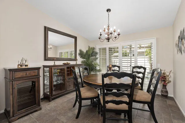 a view of a dining room with furniture window and outside view