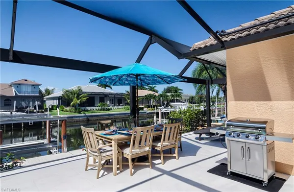 a view of an outdoor space with a table and chairs