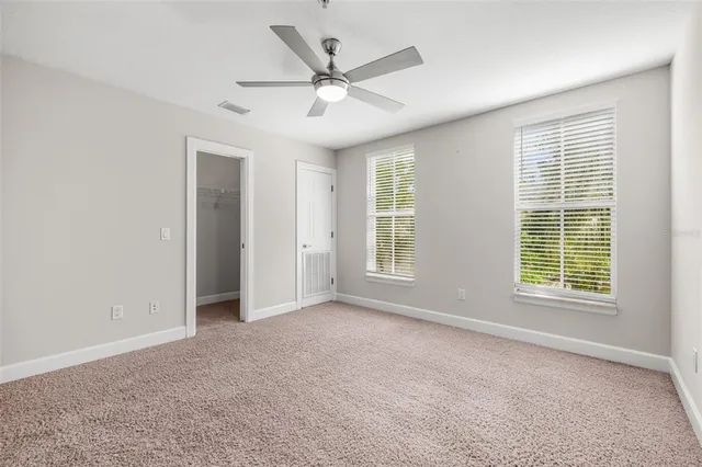a bathroom with a granite countertop sink toilet a shower and a mirror