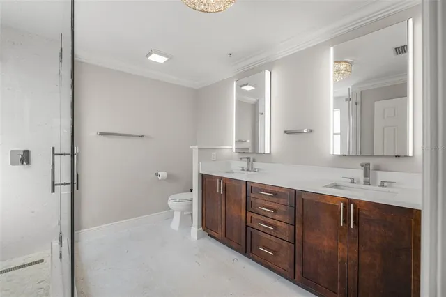 a bathroom with a shower and toilet