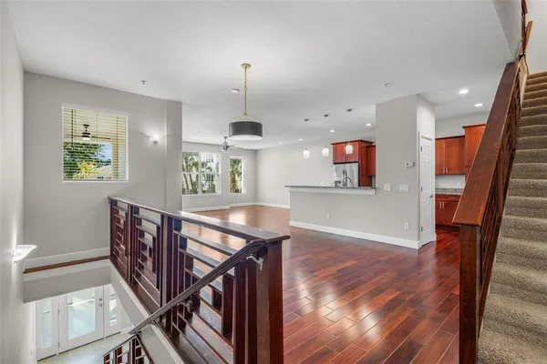 a view of entryway and hall with wooden floor