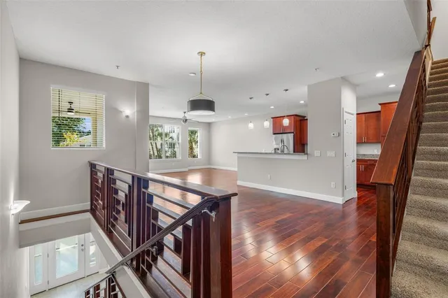 a view of entryway and hall with wooden floor