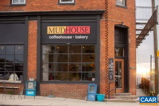 a view of a brick building with a large windows and door