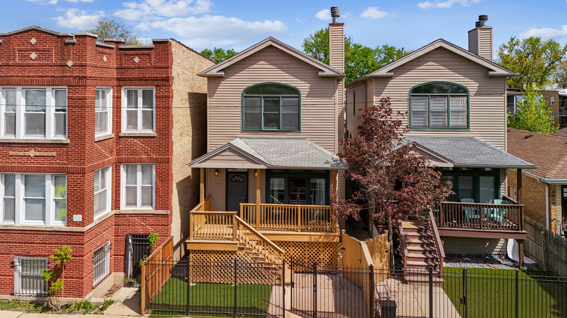 4038 West Addison Street Chicago, IL 60641 - Photo 1 of 33 a front view of a house with a garden