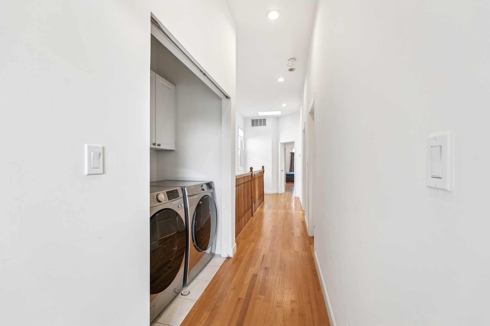 4038 West Addison Street Chicago, IL 60641 - Photo 19 of 33 a view of a hallway with a washer and dryer