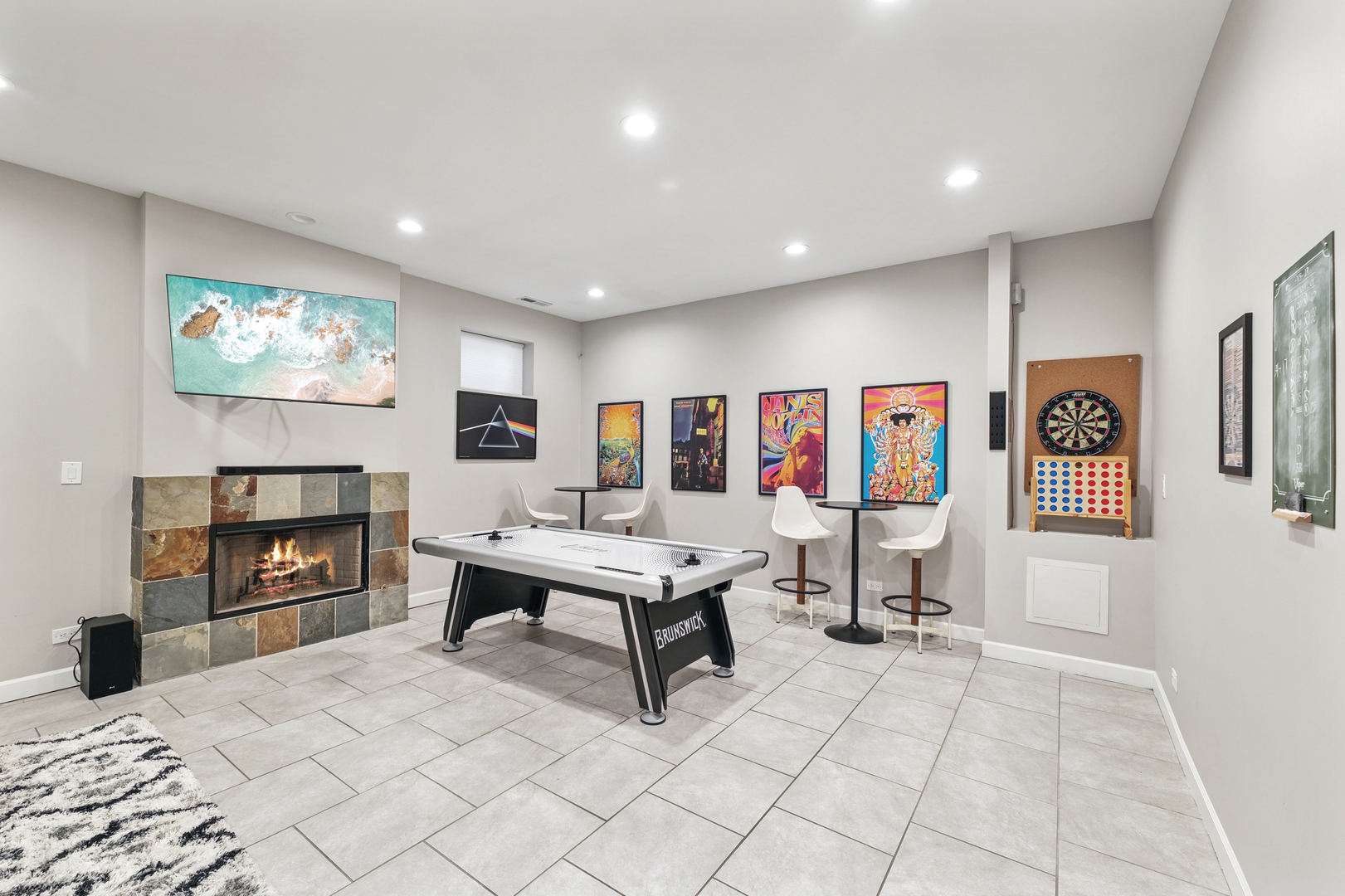 4038 West Addison Street Chicago, IL 60641 - Photo 20 of 33 a living room with furniture a flat screen tv and a fireplace