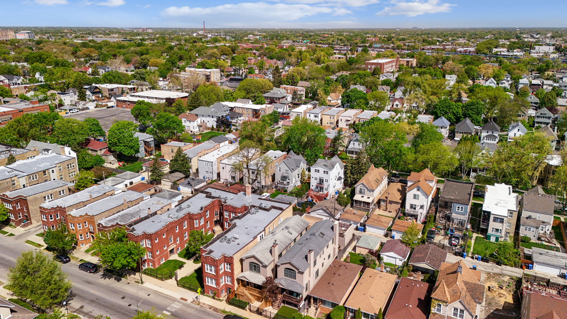 4038 West Addison Street Chicago, IL 60641 - Photo 2 of 33 an aerial view of a city with lots of residential buildings