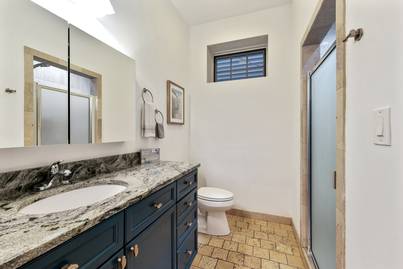 4038 West Addison Street Chicago, IL 60641 - Photo 24 of 33 a bathroom with a granite countertop sink toilet and a mirror