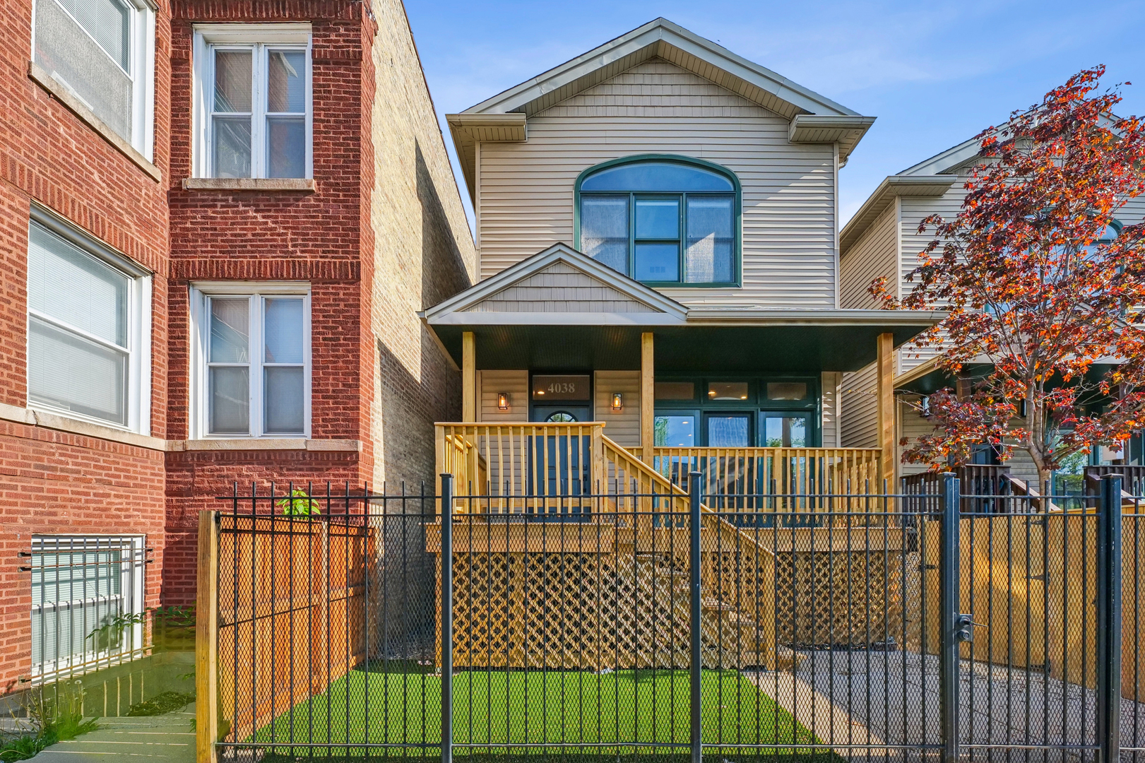 4038 West Addison Street Chicago, IL 60641 - Photo 27 of 33 a front view of a house with iron fence