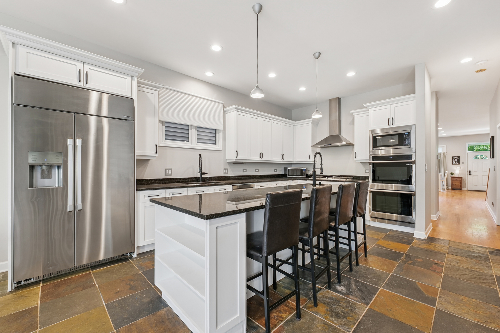 4038 West Addison Street Chicago, IL 60641 - Photo 8 of 33 a kitchen with stainless steel appliances granite countertop a refrigerator a stove a sink and a refrigerator