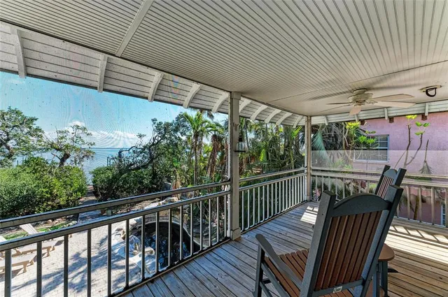a view of a two chairs in the balcony