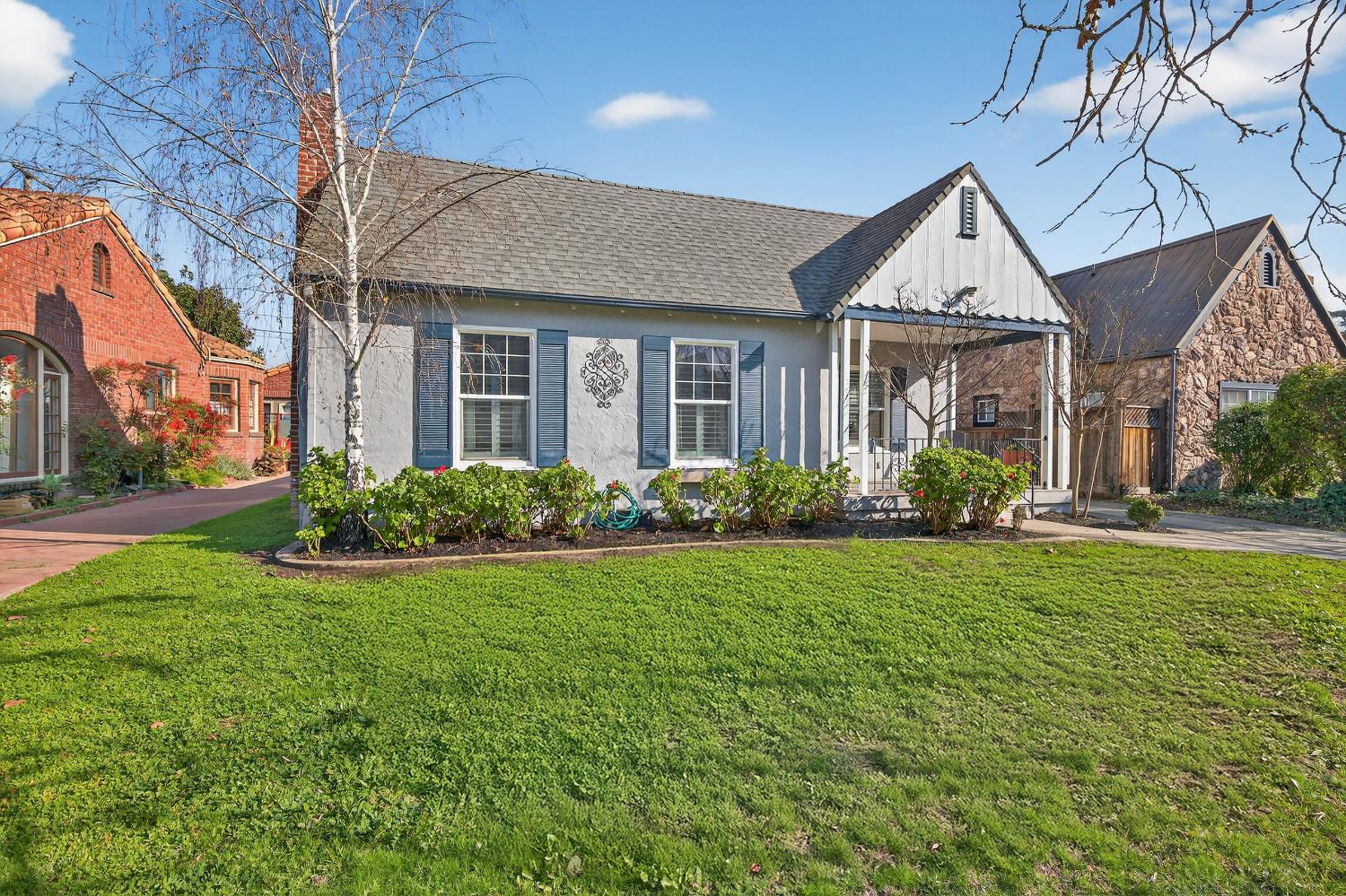 a front view of a house with garden