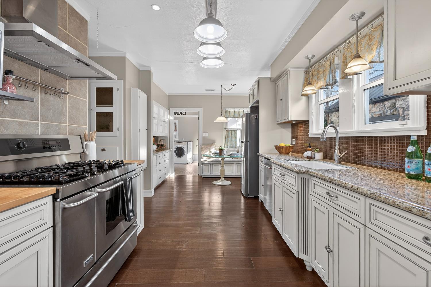 2644 Crafton Way Stockton, CA 95204 - Photo 16 of 50 a kitchen with stainless steel appliances granite countertop a stove and cabinets