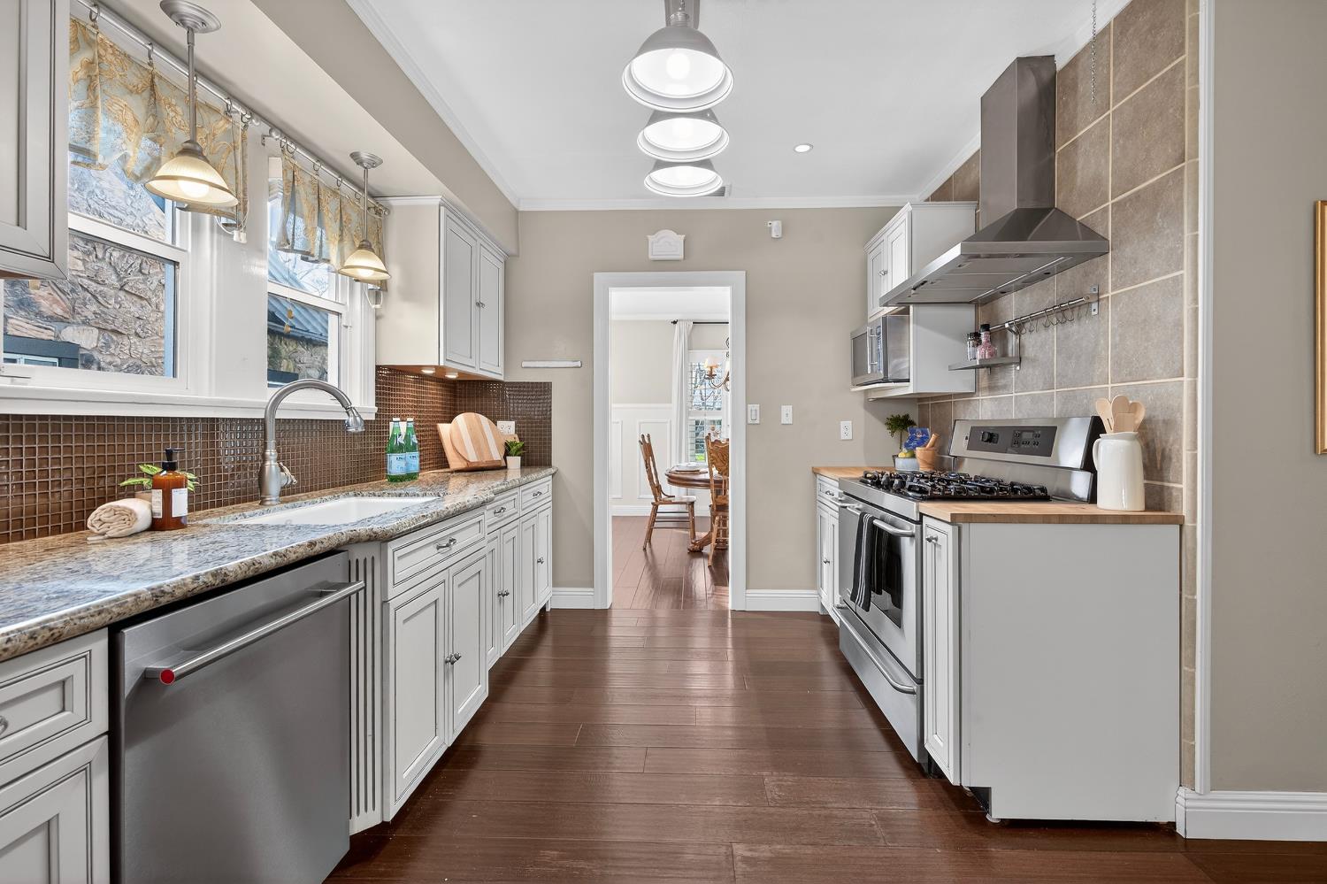2644 Crafton Way Stockton, CA 95204 - Photo 18 of 50 a kitchen with granite countertop a sink appliances cabinets and a counter top space