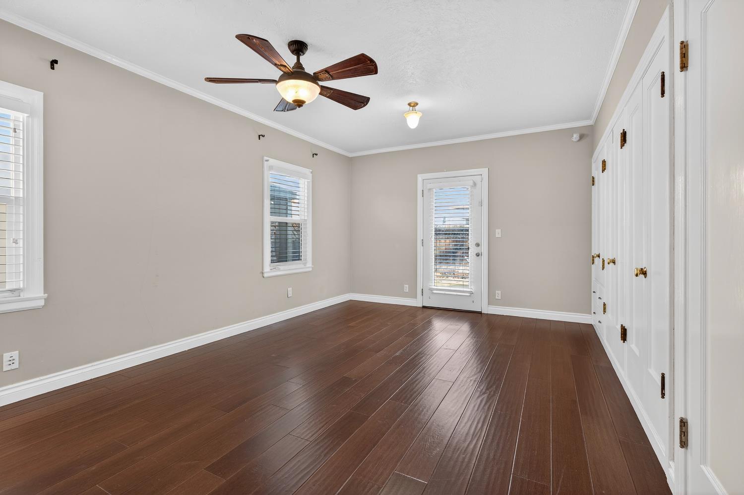 2644 Crafton Way Stockton, CA 95204 - Photo 23 of 50 a view of an empty room with wooden floor and a window