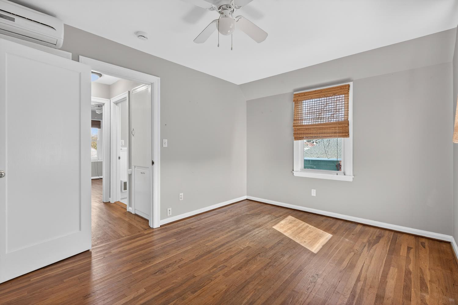 2644 Crafton Way Stockton, CA 95204 - Photo 33 of 50 an empty room with wooden floor chandelier fan and windows