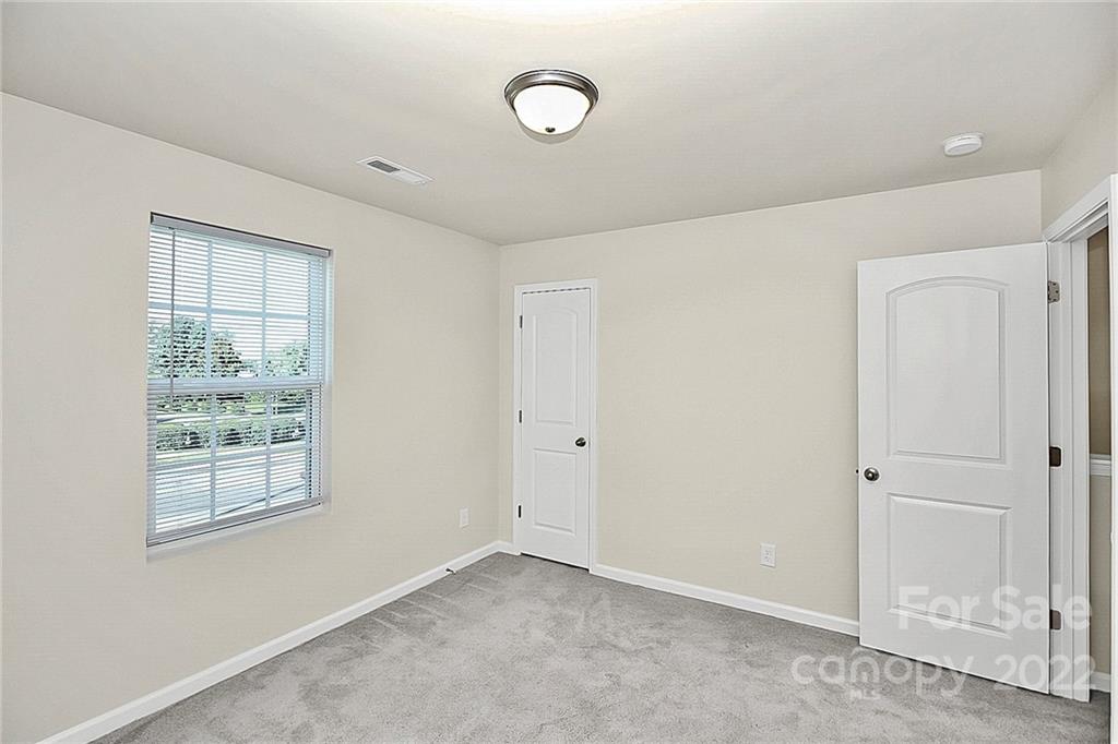 8729 Pence Road Charlotte, NC 28215 - Photo 15 of 26 a view of an empty room with a window