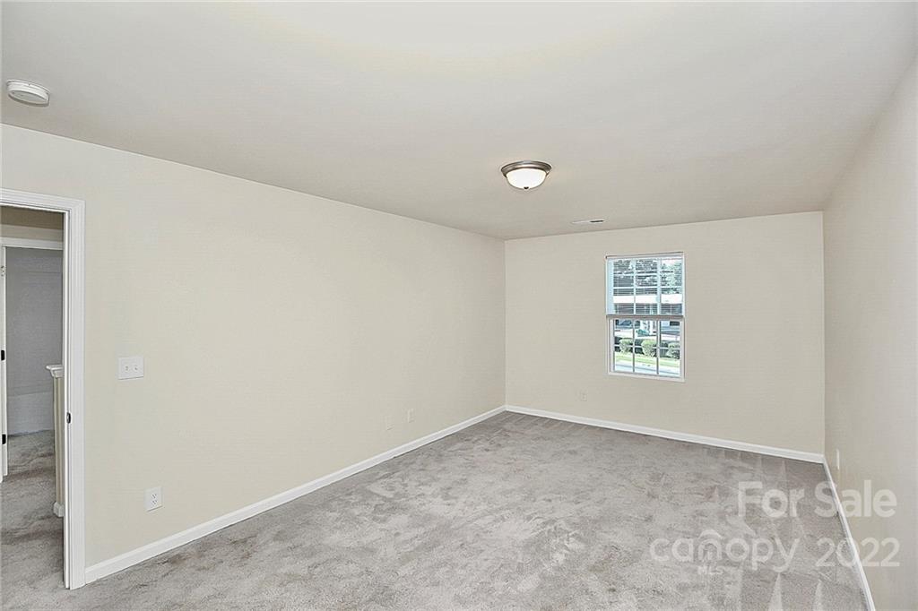 8729 Pence Road Charlotte, NC 28215 - Photo 20 of 26 an empty room with a window