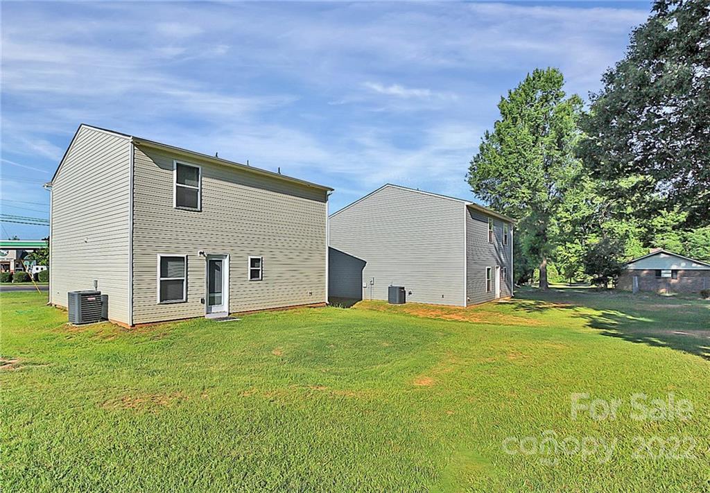 8729 Pence Road Charlotte, NC 28215 - Photo 25 of 26 a house view with a sitting space and garden