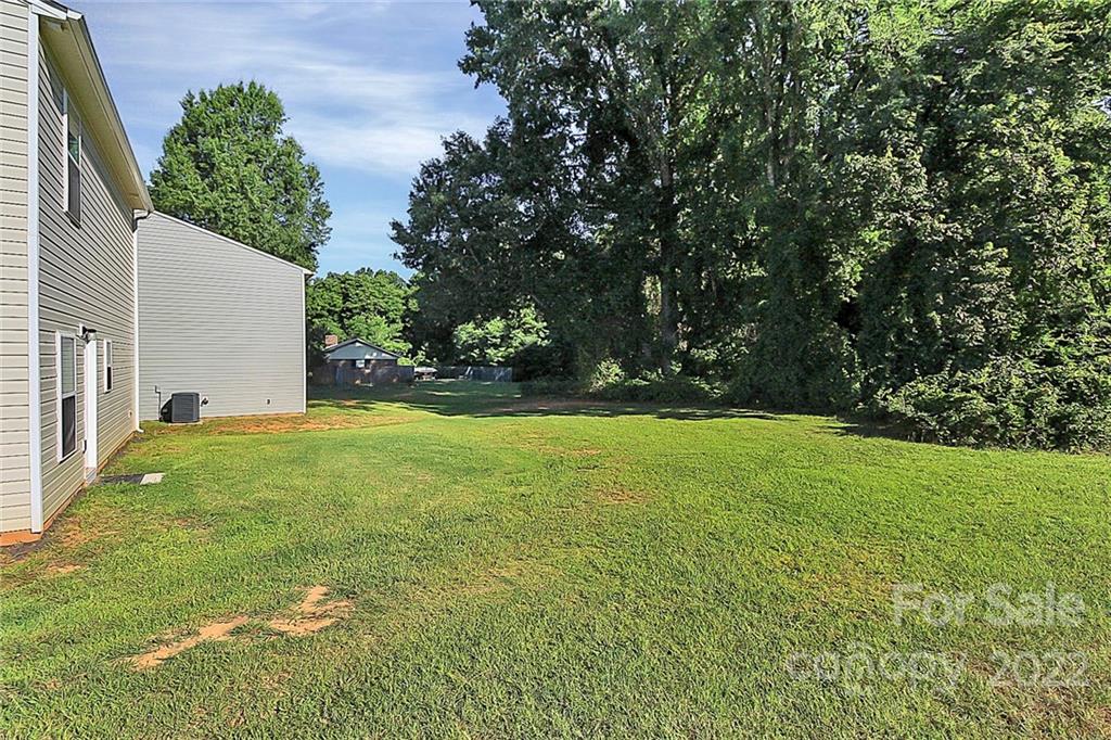 8729 Pence Road Charlotte, NC 28215 - Photo 26 of 26 a view of yard with green space