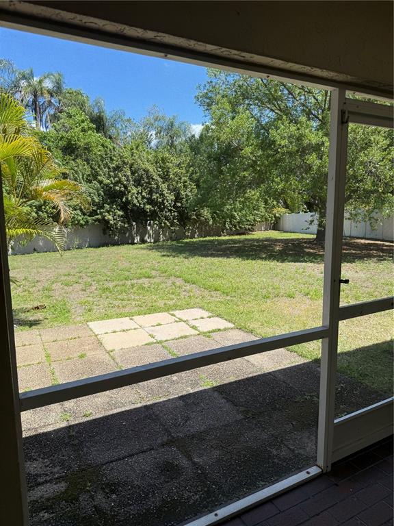 4833 Post Pointe Drive Sarasota, FL 34233 - Photo 29 of 29 a view of a yard with an outdoor space