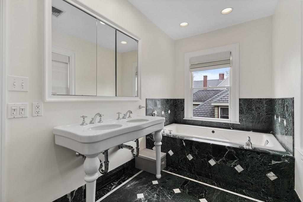 28 Balcarres Road Newton, MA 02465 - Photo 14 of 21 a bathroom with a sink and a mirror
