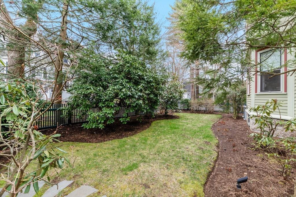 28 Balcarres Road Newton, MA 02465 - Photo 19 of 21 a view of a backyard with table and chairs and potted plants