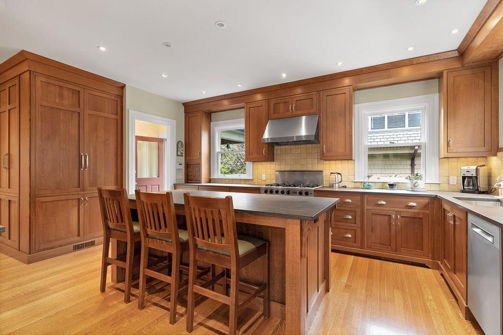 28 Balcarres Road Newton, MA 02465 - Photo 4 of 21 a kitchen with stainless steel appliances granite countertop table chairs sink and cabinets