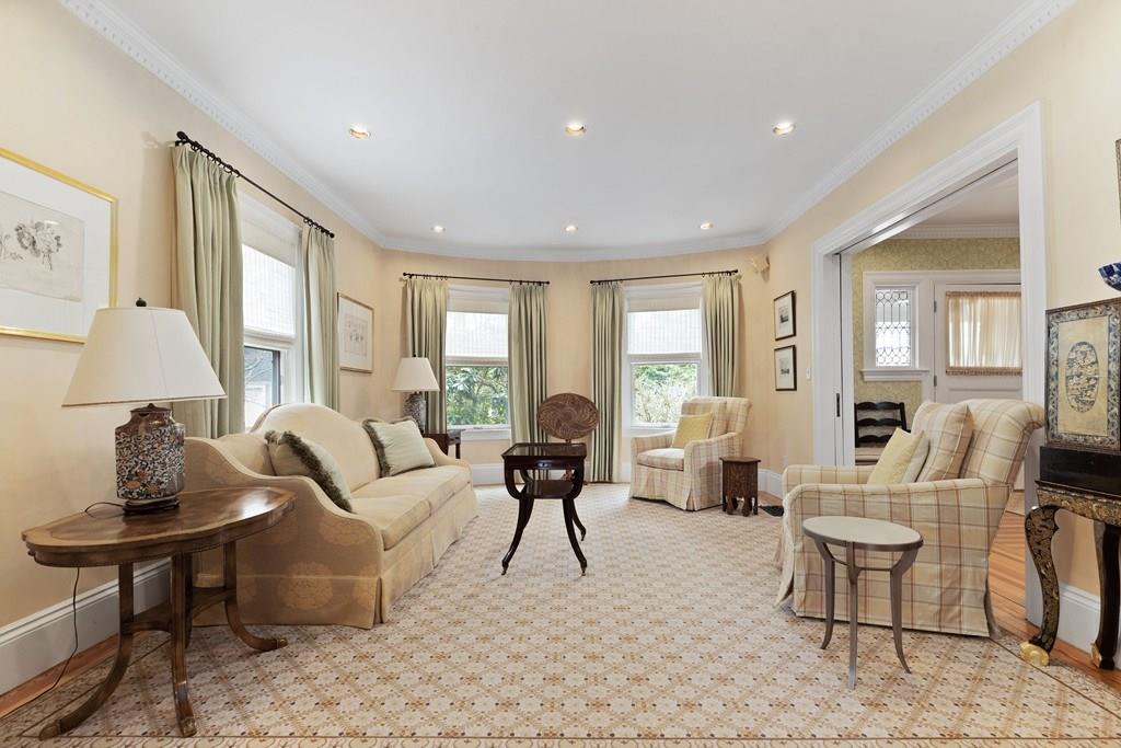 28 Balcarres Road Newton, MA 02465 - Photo 7 of 21 a living room with furniture fireplace and a large window