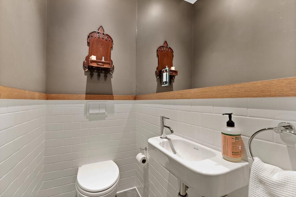28 Balcarres Road Newton, MA 02465 - Photo 9 of 21 a bathroom with a toilet sink and mirror