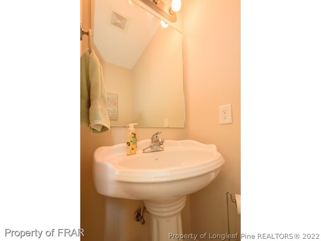 11 Lattimore Road Cameron, NC 28326 - Photo 13 of 28 a bathroom with a sink and a mirror