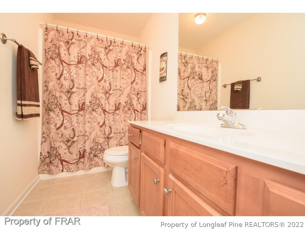 11 Lattimore Road Cameron, NC 28326 - Photo 21 of 28 a bathroom with a sink and a toilet