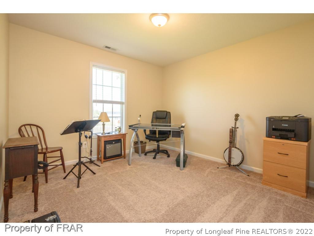 11 Lattimore Road Cameron, NC 28326 - Photo 22 of 28 a living room with furniture and a window