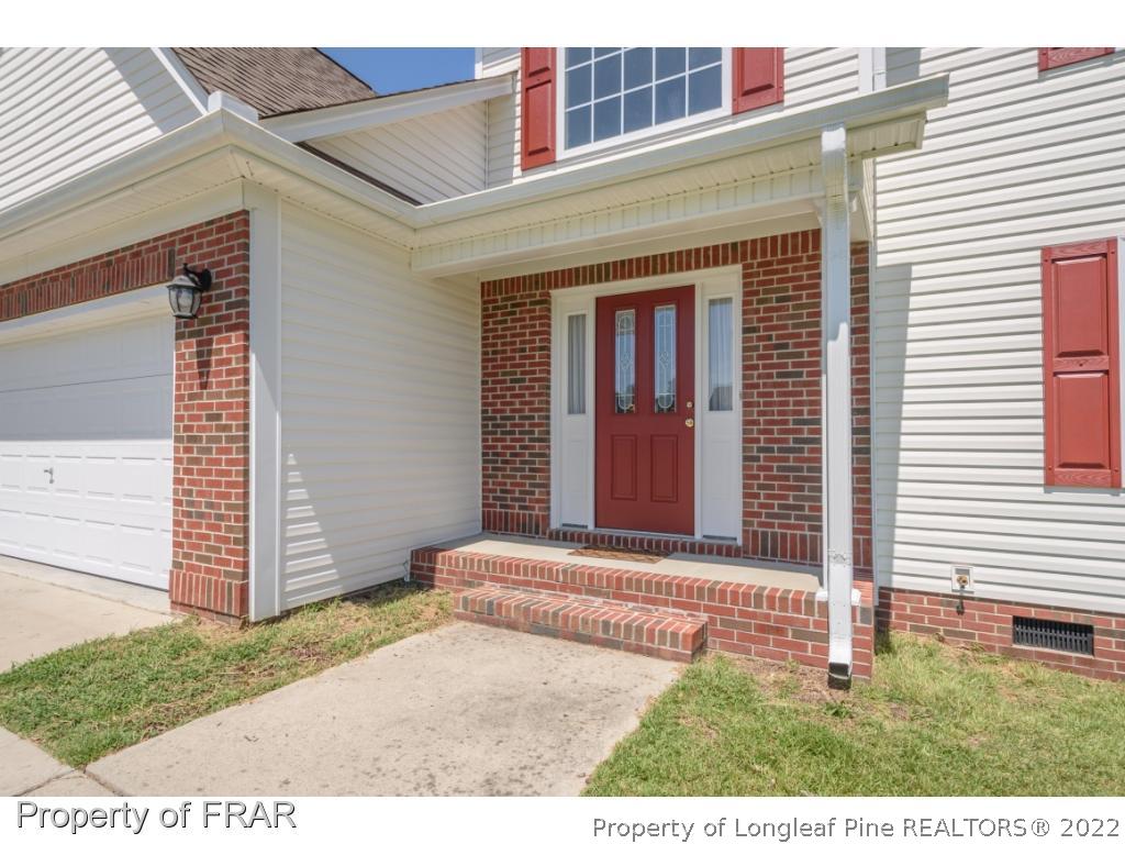 11 Lattimore Road Cameron, NC 28326 - Photo 3 of 28 a view of a house with a small yard and wooden floor and fence