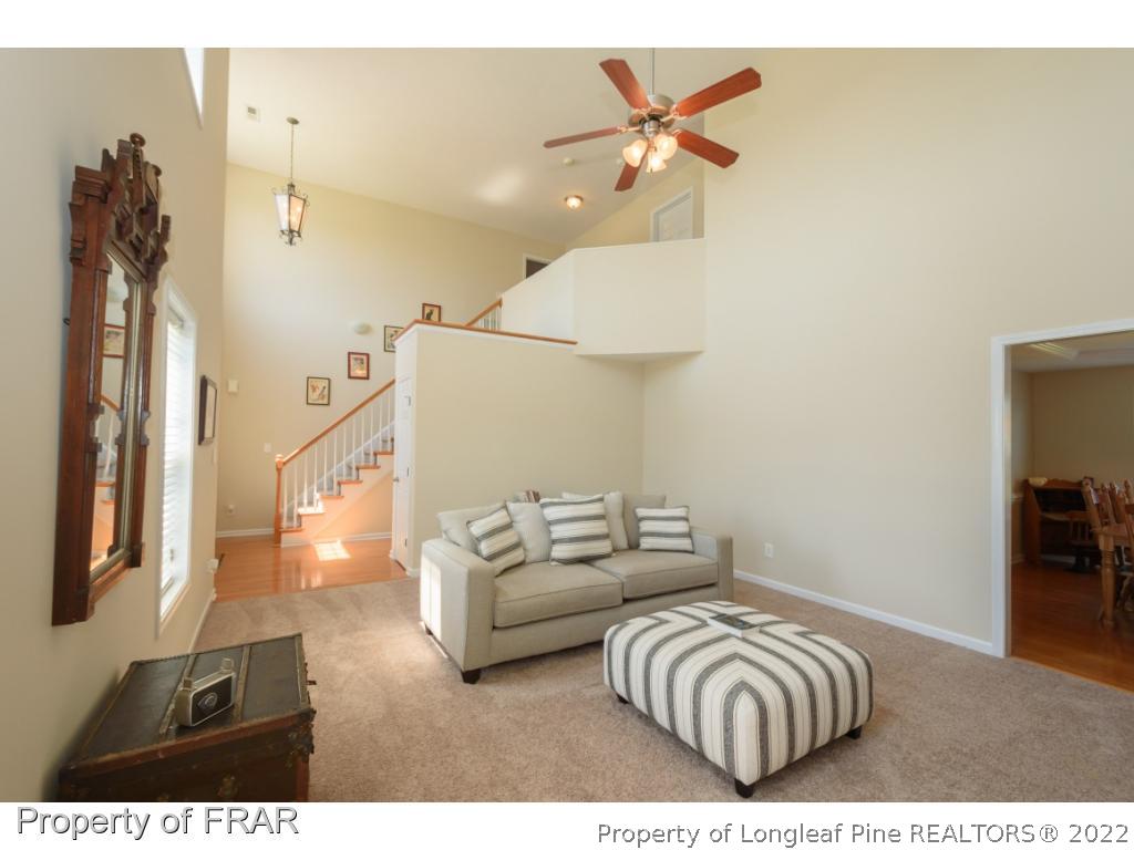 11 Lattimore Road Cameron, NC 28326 - Photo 7 of 28 a living room with furniture and a chandelier