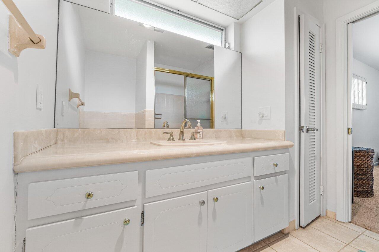 1350 Southwest 13th Place Boca Raton, FL 33486 - Photo 14 of 27 a bathroom with a sink and a mirror