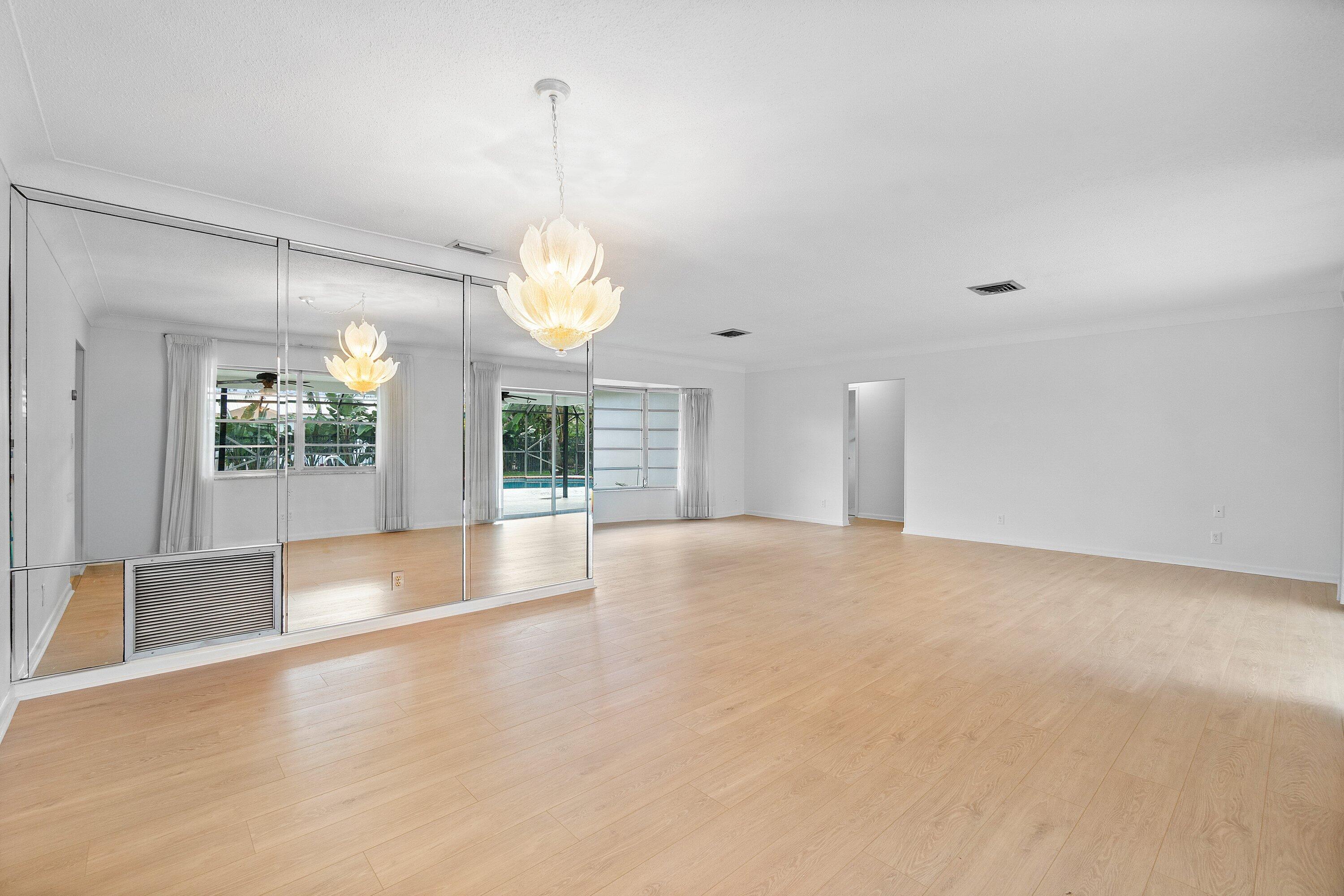 1350 Southwest 13th Place Boca Raton, FL 33486 - Photo 5 of 27 a view of an empty room with window and chandelier