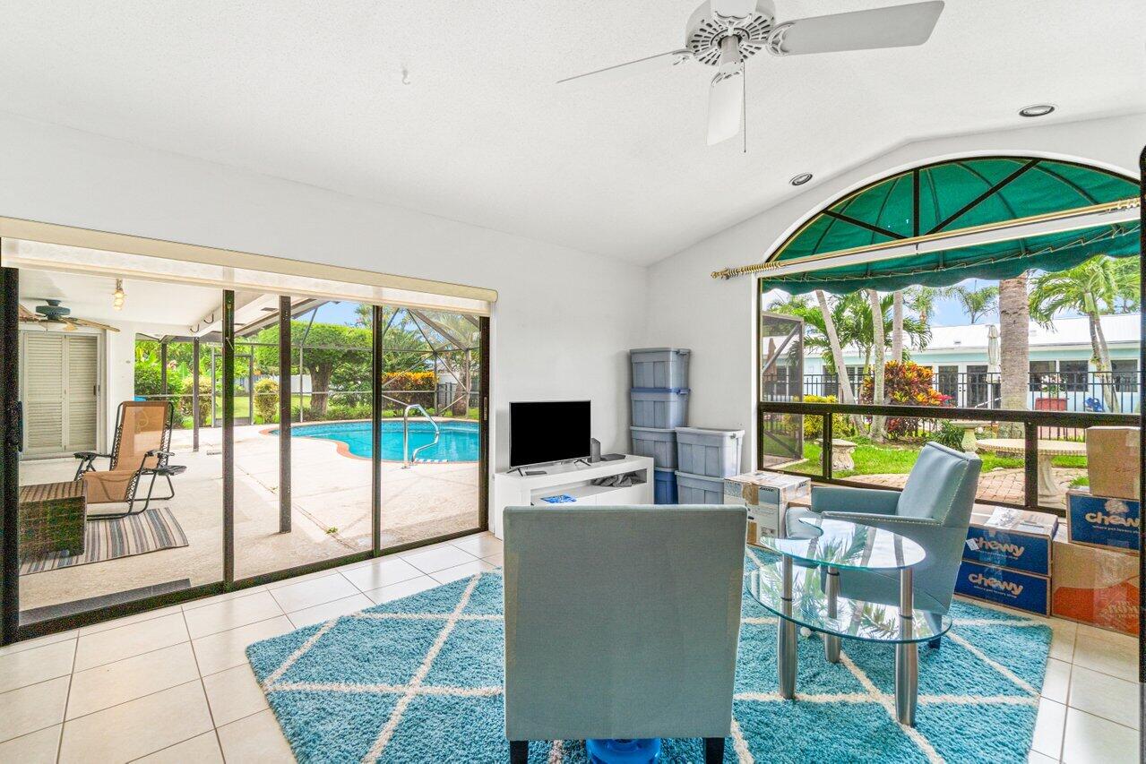 1350 Southwest 13th Place Boca Raton, FL 33486 - Photo 9 of 27 a work room with furniture and garden view