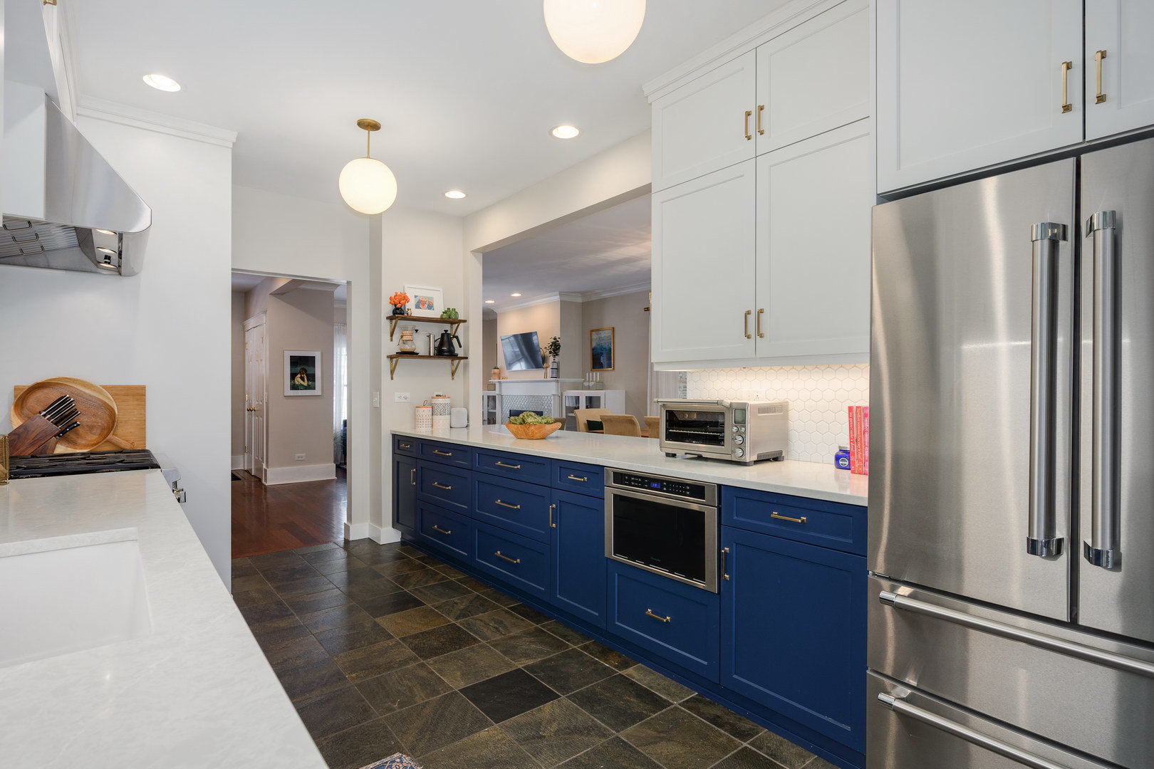 2249 West Leland Avenue Chicago, IL 60625 - Photo 11 of 40 a kitchen with stainless steel appliances granite countertop a refrigerator sink and cabinets