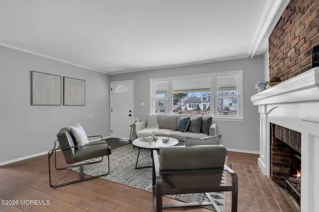 a dining room with furniture and wooden floor