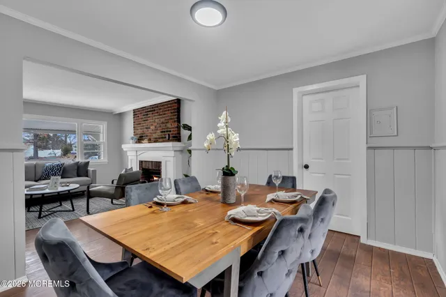 a large kitchen with stainless steel appliances granite countertop a sink and dishwasher a stove top oven with wooden floor