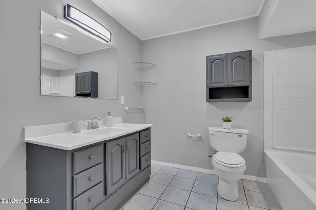 a view of a hallway view with wooden floor and staircase