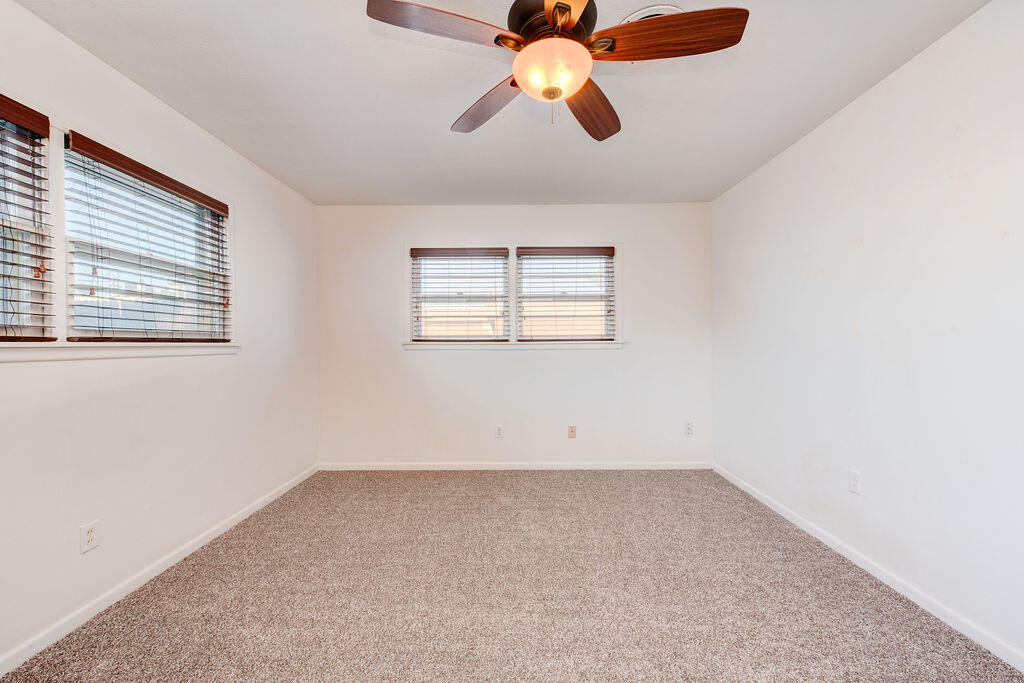 4406 26th Street Lubbock, TX 79410 - Photo 17 of 22 an empty room with chandelier fan