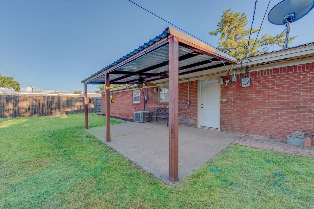 4406 26th Street Lubbock, TX 79410 - Photo 20 of 22 a view of a house with a backyard