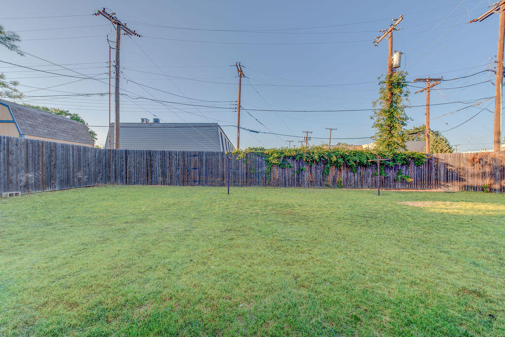 4406 26th Street Lubbock, TX 79410 - Photo 21 of 22 a view of a backyard with a garden and plants