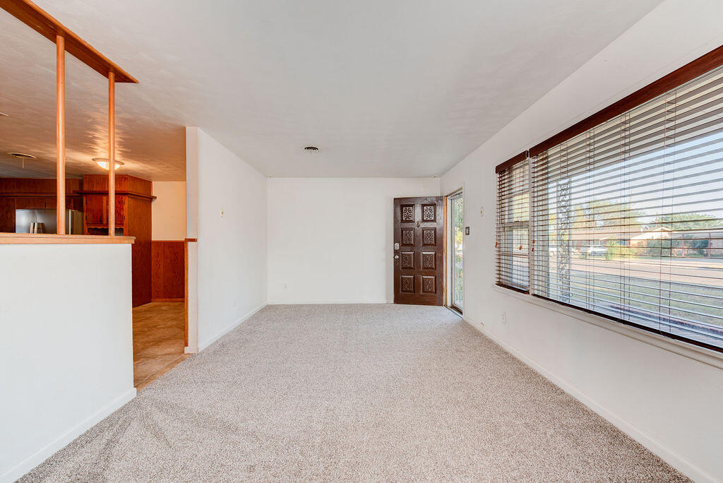 4406 26th Street Lubbock, TX 79410 - Photo 5 of 22 an empty room with windows