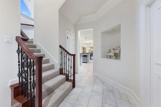 a spacious bedroom with a bed and a couch