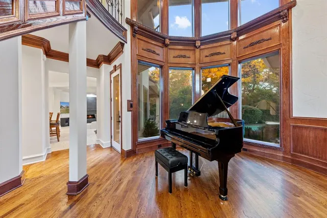 a living room with a table and chairs