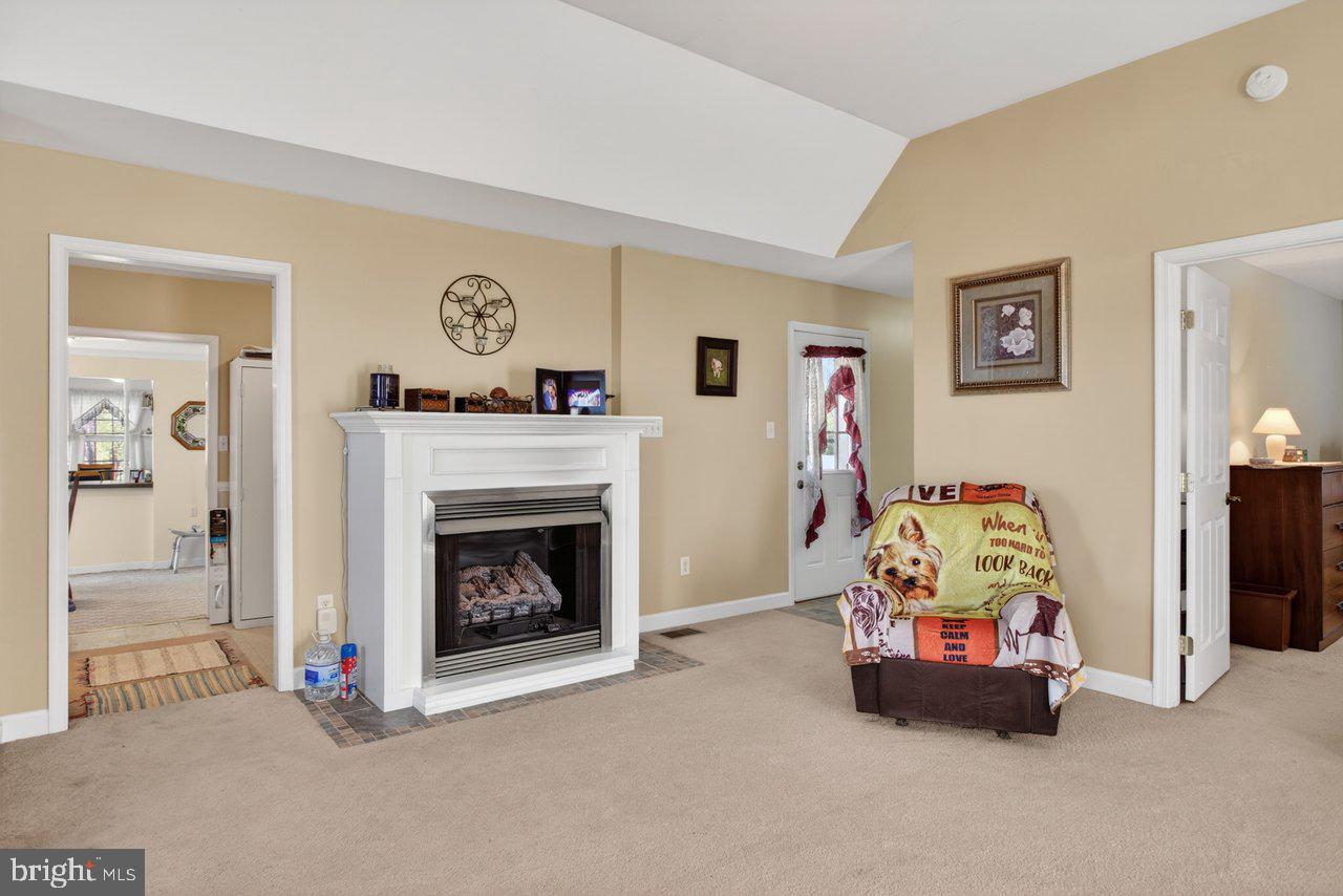1751 Orchard Road Mount Jackson, VA 22842 - Photo 12 of 30 a bedroom with a bed and a fireplace