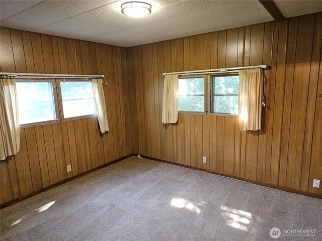 a view of backyard with outdoor seating and green space